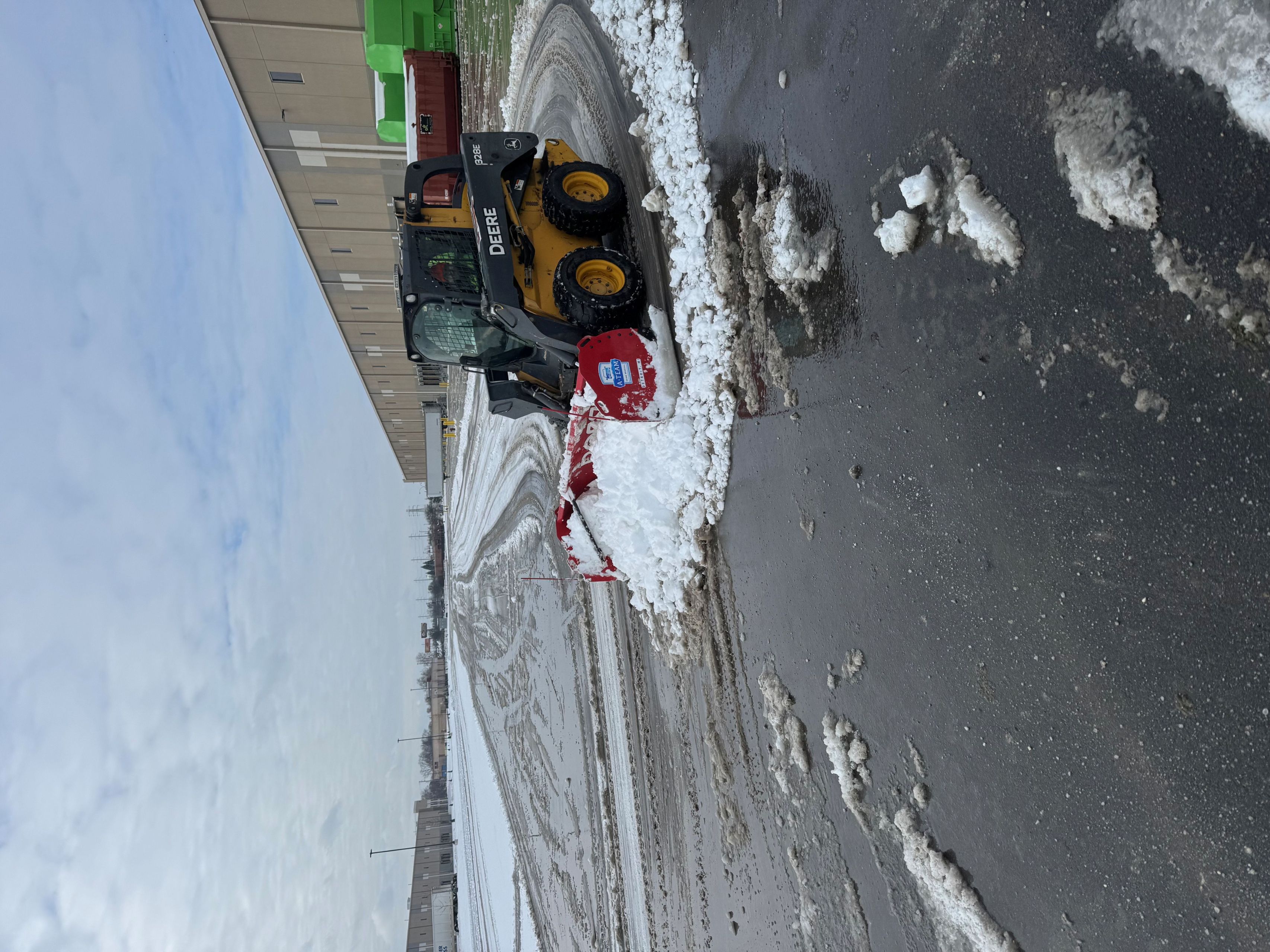Snow removal — skid steer lot clearing